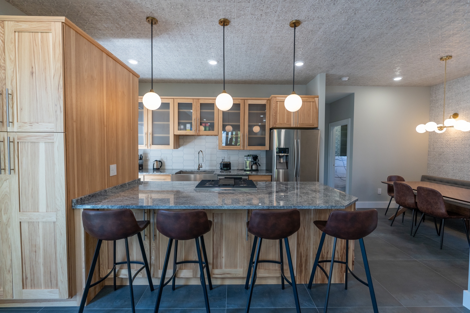 Contemporary Kitchen With Natural Wood Cabinetry Kitchen Remodel by Sarisand Tile project photo